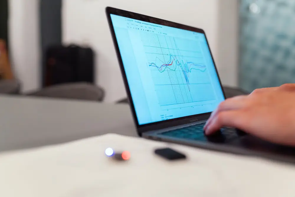A performance graph reviewed on a laptop